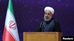 Dalam foto yang dirilis oleh kantor Kepresidenan Iran, President Hassan Rouhani berbicara dalam upacara peringatan "Hari Nuklir Nasional" , 9 April 2018.