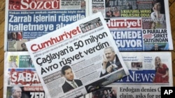 Front pages are seen of some Turkish newspapers with headlines concerning a trial in New York against a Turkish banker charged with violating U.S. sanctions against Iran, in Ankara, Turkey, Nov. 30, 2017. 