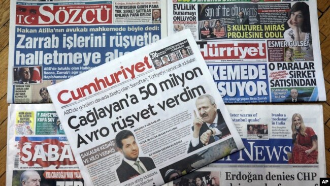FILE - Front pages of some of Turkish newspapers with headlines concerning a trial in New York against Turkish banker Reza Zarrab, charged with violating U.S. sanctions against Iran, in Ankara, Turkey, Nov. 30, 2017.