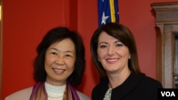 Acting VOA Director Kelu Chao (L) with Kosovo President Atifete Jahjaga