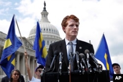 FILE - Rep. Joe Kennedy, D-Mass., speaks in support of transgender members of the military on Capitol Hill in Washington, July 26, 2017. He delivers the Democratic response to President Donald Trump's State of the Union address Tuesday.