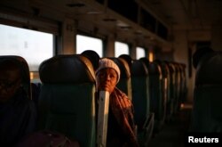 A passenger travels on a sleeper train from Harare to Bulawayo, Zimbabwe, Aug. 6, 2018.
