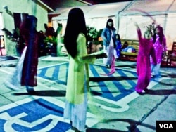 Vietnamese American kids, in Vietnamese custom “Ao Dai”, were practicing silk-dance for TET festival