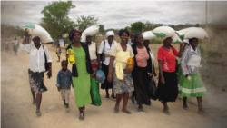 Residents take advantage of a maize distribution program in Zimbabwe. (Credit: World Food Program)