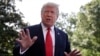 President Donald Trump talks with reporters before departing on Marine One, May 30, 2019, in Washington.