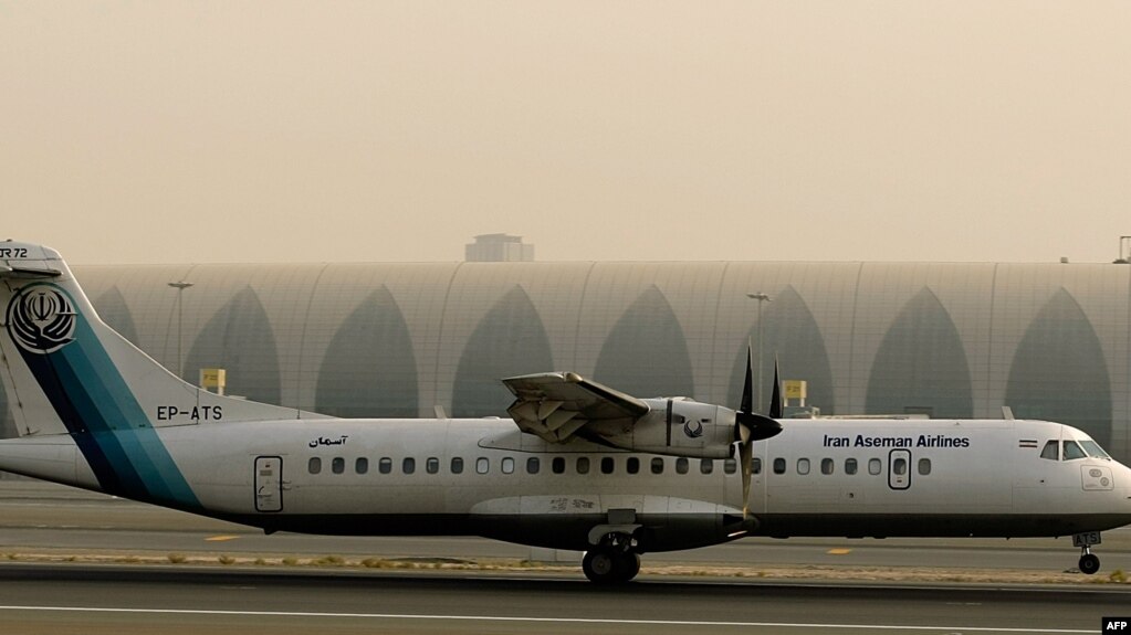 FILE - A French-made ATR-72 owned by Iran's Aseman Airlines sits on the tarmac at Dubai airport, July 29, 2008.