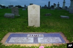 The gravesite of infamous Wild West outlaw Jesse James and his wife, Zerelda, the first cousin he married after a 9-year courtship, at a cemetery in Kearney, Missouri.