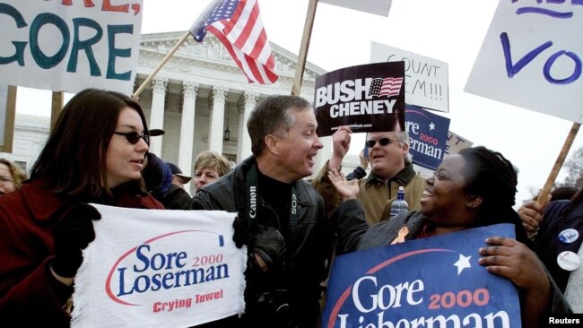 FILE - Supporters of Democrat U.S. Vice President Al Gore (R) and Republican Texas Governor George W. Bush face off against one another in front of the U. S. Supreme Court before Gore's attorney David Boies and Bush attorney Barry Richard entered the cour