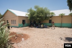 Former Al-Shabab members sit for lunch at a rehabilitation center for former militants in Baidoa, Somalia on September 17, 2016.