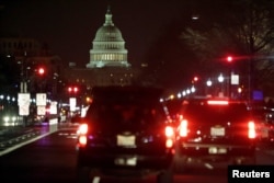 A motorcade drives along Pennsylvania Avenue as U.S. President Donald Trump goes for a dinner at Trump International Hotel in Washington, March 25, 2017.