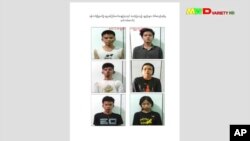 This image from an April 18, 2021 news report by Myawaddy TV shows people who security forces said they detained in a weapons raid a day earlier in Yangon, Myanmar. (Myawaddy TV via AP)