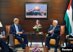 U.S. Secretary of State John Kerry (L) meets with Palestinian President Mahmoud Abbas in the West Bank city of Ramallah July 19, 2013.