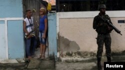 An armed forces member patrols during an operation against drug dealers in Vila Alianca slum, in Rio de Janeiro, Feb. 27, 2018. 