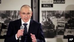 Mikhail Khodorkovsky speaks during his first news conference after his release in Berlin, Sunday, Dec. 22, 2013. 