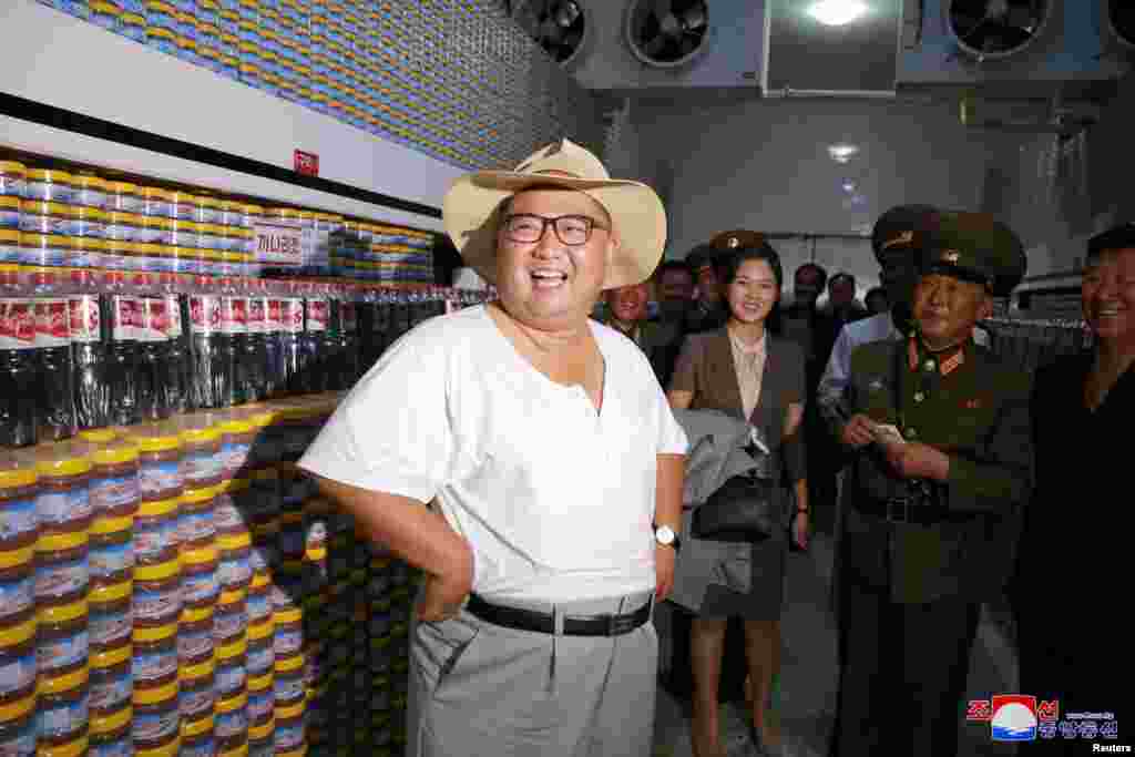 North Korean leader Kim Jong Un visits a factory in this undated photo released by North Korea's Korean Central News Agency (KCNA) on August 7, 2018.