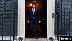 FILE - Britain's Foreign Secretary Jeremy Hunt leaves 10 Downing Street, London, Britain, Nov. 13, 2018.