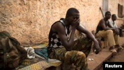 FILE - A man reacts in the RDOT camp in Kilometre 11 (PK11), where some of the last remaining ex-Seleka fighters are sheltering, guarded by African Union and French peacekeeping forces in the capital Bangui, March 14, 2014. 