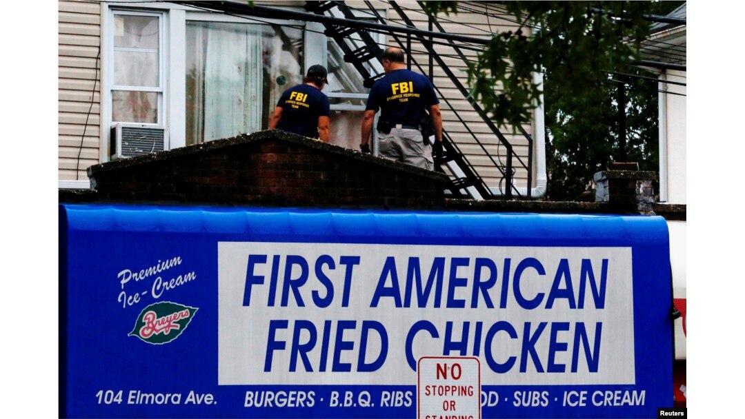 Federal Bureau of Investigation personnel search an address during an investigation into Ahmad Khan Rahami, who was wanted for questioning in an explosion in New York, which authorities believe is linked to the explosive devices found in New Jersey, Sept. 19, 2016.