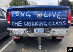 A diesel truck that belongs to a self-employed logger is parked in Salem, Ore., June 20, 2019, the day the Senate was scheduled to take up a bill that would create the nation's second cap-and-trade program to curb carbon emissions. Senate Republicans, however, walked out so there wouldn't be enough lawmakers present for a vote on House Bill 2020.