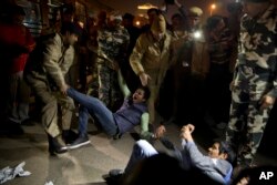 Indian youth shout slogans as they are detained by police during a protest against the release of a juvenile convicted in the fatal 2012 gang rape that shook the country in New Delhi, India, Dec.20, 2015.
