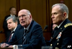 FILE - Director of National Intelligence Daniel Coats testifies before the Senate Intelligence Committee on Capitol Hill in Washington, Jan. 29, 2019.