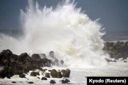 High waves triggered by Typhoon Cimaron crash against the coast of Aki, Kochi Prefecture, western Japan, Aug. 23, 2018.