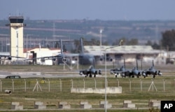 Saudi jet fighters are shown parked at Incirlik Air Base in southern Turkey, Feb. 26, 2016.