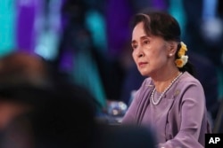 FILE - Myanmar leader Aung San Suu Kyi listens to the opening speech at the Leaders Plenary during ASEAN-Australia Special Summit, March 18, 2018, in Sydney.