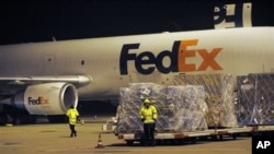 A cargo plane is loaded at the FedEx distribution center at the International Cargo Airport in Cologne, western Germany, 01 Nov 2010
