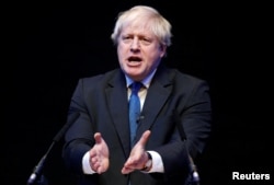 FILE - Boris Johnson speaks at the Conservative Home fringe meeting at the Conservative Party Conference in Birmingham, Britain, Oct. 2, 2018.