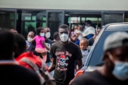 Seorang migran yang dideportasi tiba di bandara Port au Prince, 19 September 2021. (AFP)