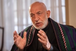 Former President of Afghanistan Hamid Karzai speaks during an interview with the Associated Press in Kabul, Dec. 10, 2021.