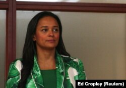 FILE - Isabel dos Santos, the daughter of Angolan President Jose Eduardo dos Santos, speaks to journalists before being sworn in as chief executive of state oil firm Sonangol in Luanda, Angola, June 6, 2016.