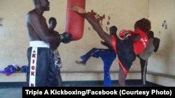 Winnie Natasha (R) delivers a targeted kick during training with the Triple A Kickboxing team in Juba.