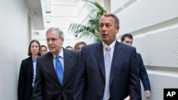 FILE - House Speaker John Boehner (r) walks with Senate Minority Leader Mitch McConnell. 