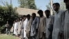 FILE - Islamic State fighters, who were arrested by Afghan security personal, are presented to the media at the Afghan police headquarters in Jalalabad, east of Kabul, Afghanistan, May 9, 2016.