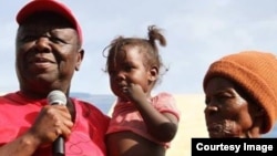 FILE: Morgan Tsvangirai captured at a village in Zimbabwe visiting people who strongly believe that he will form the next government after performing dismally in the last elections which the former trade unionist claims were rigged by Zanu PF. (VOA Photo; 2013)