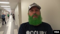 Ryan Trundle of Shreveport, La., a former Bernie Sanders delegate at the Democratic convention, wore a Bernie cap to the Green Party gathering in Houston and dyed his beard green to demonstrate his enthusiasm for Jill Stein. (G. Flakus/VOA)