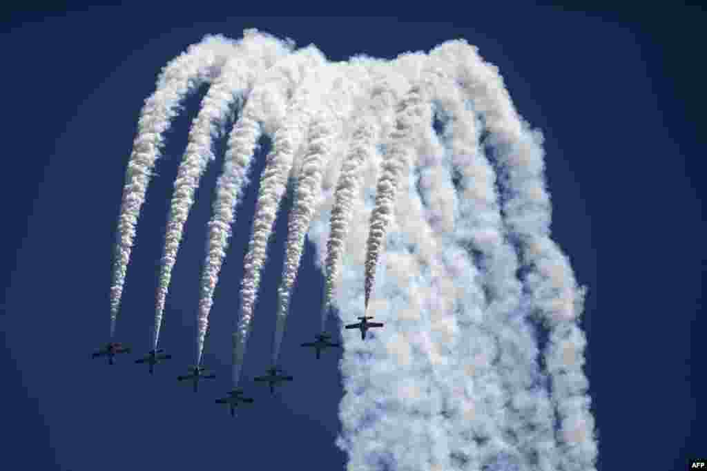 The aerobatic demonstration team of the Spanish Air Force &quot;Patrulla Aguila&quot; performs during the 2018 International Torre del Mar Airshow.