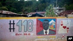 FILE - A mural features senatorial candidate Guy Philippe in Pestel, Haiti, Aug. 25, 2016.