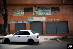 A car is parked in front of Los Cotorros, a club in the neighborhood of El Paraiso, in Caracas, Venezuela, June 16, 2018.