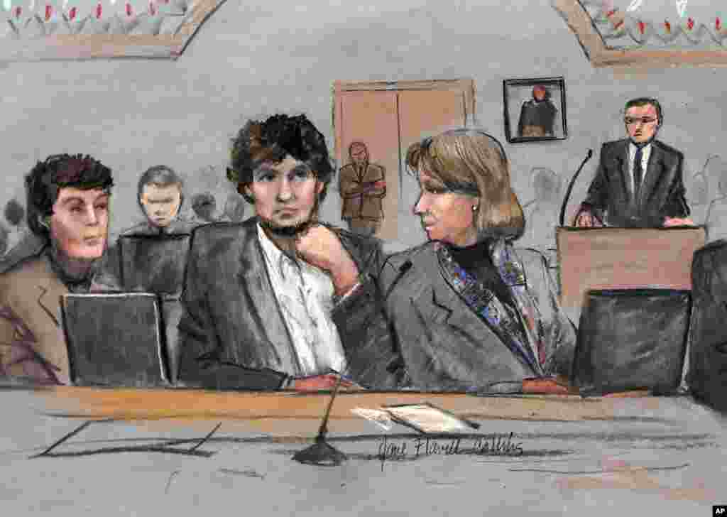 FILE - In this courtroom sketch, Dzhokhar Tsarnaev, center, is depicted between defense attorneys Miriam Conrad, left, and Judy Clarke, right, during his federal death penalty trial.