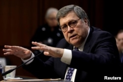 FILE - William Barr testifies at a Senate Judiciary Committee hearing on his nomination to be attorney general of the United States on Capitol Hill in Washington, Jan. 15, 2019.