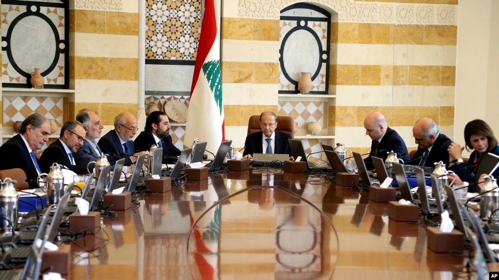 In this photo released by Lebanon's official government photographer Dalati Nohra, shows Lebanese President Michel Aoun, center, heading a cabinet meeting, at the presidential palace, in Baabda east of Beirut, Lebanon, Tuesday, April 30, 2019. 