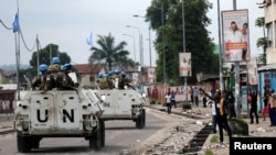 Peacekeepers serving in the United Nations Organization Stabilization Mission in the Democratic Republic of the Congo (MONUSCO) patrol in their armored personnel carrier during demonstrations against Congolese President Joseph Kabila in the streets of Kinshasa, Dec. 20, 2016. 