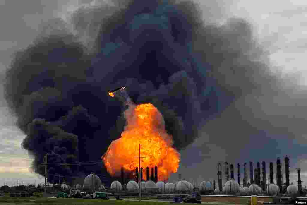 A process tower flies through air after exploding at the TPC Group Petrochemical Plant, after a massive explosion sparked a blaze at the plant in Port Neches, Texas, No. 27, 2019.