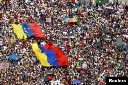 Opposition supporters take part in a rally against Venezuelan President Nicolas Maduro's government in Caracas, Venezuela, Feb. 2, 2019.