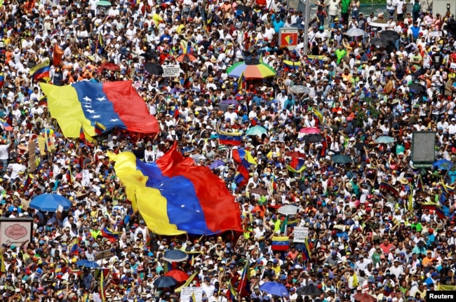 Opposition supporters take part in a rally against Venezuelan President Nicolas Maduro's government in Caracas, Venezuela, Feb. 2, 2019.