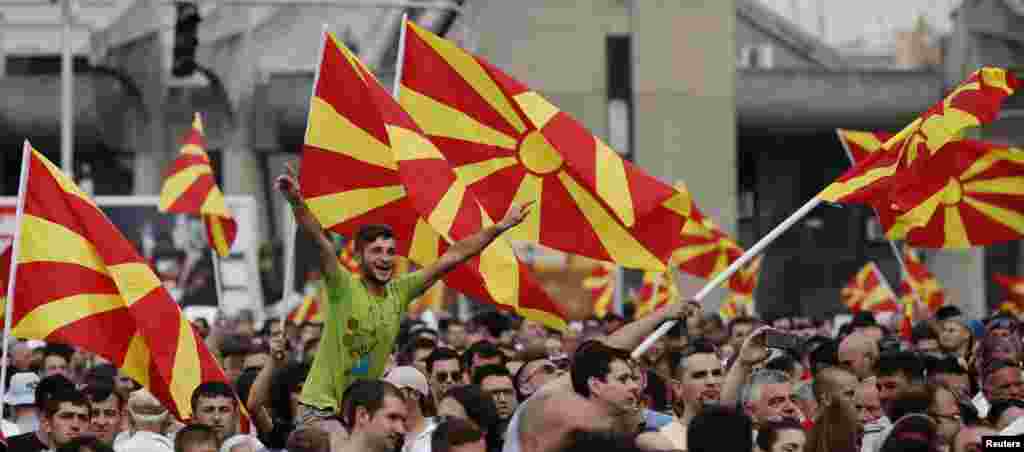 Protesters wave Macedonian flags during an anti-government demonstration in Skopje, May 17, 2015.