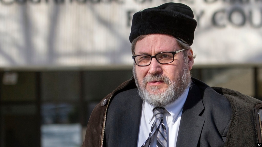 FILE - In this Feb. 19, 2015 file photo, Rabbi Bernard Freundel leaves the D.C. Superior Court House in Washington.